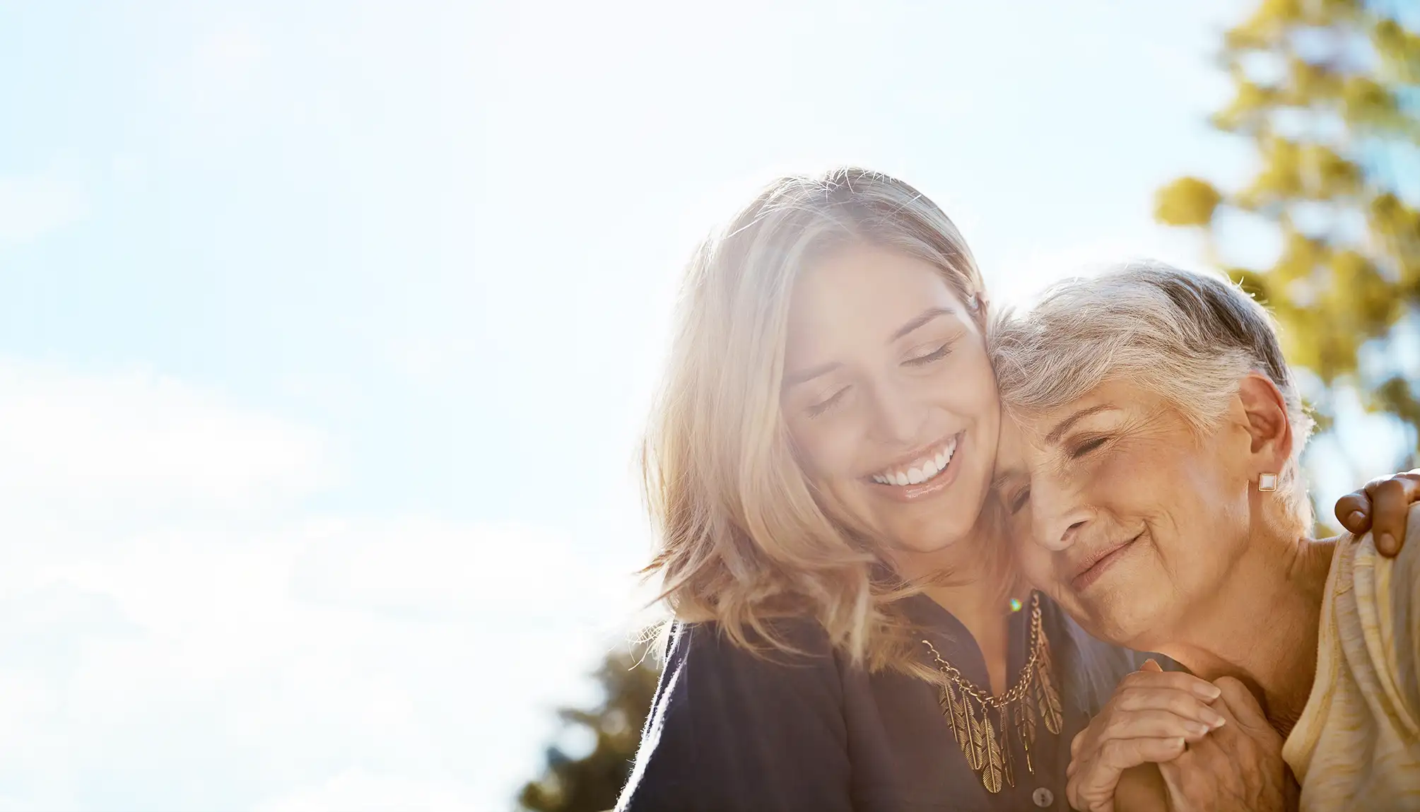 Mother and daughter hug each other with love and care